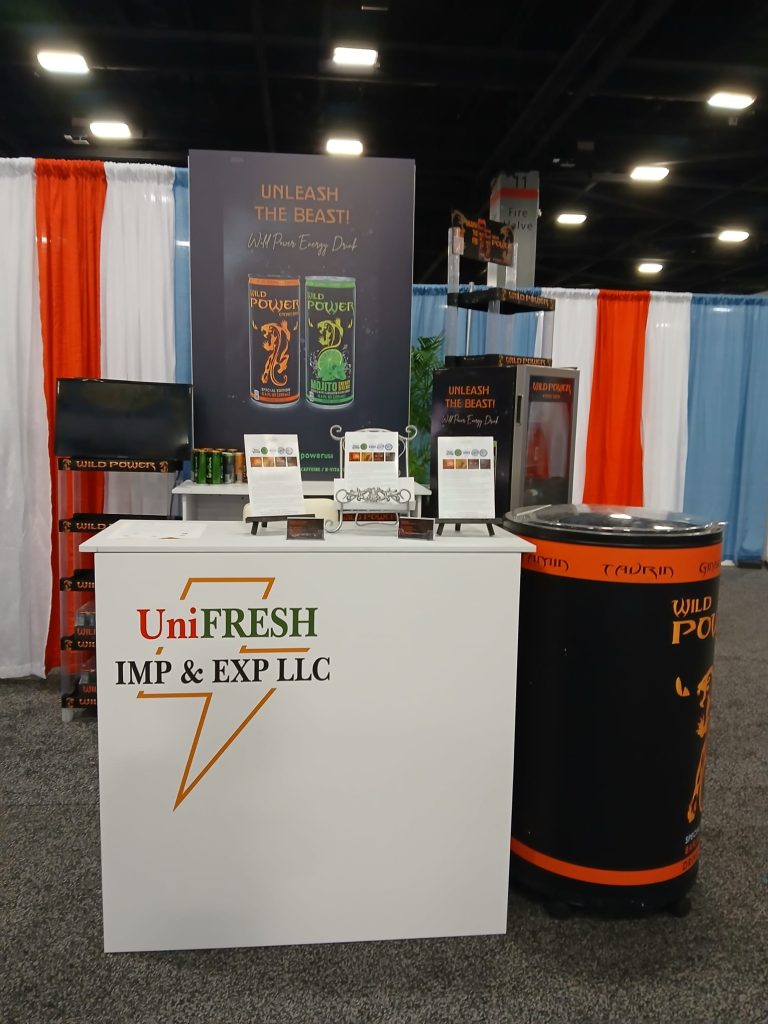 The UniFRESH stand at the Americas Food and Beverage Show in Miami, with the Wild Power display and branded cooler
